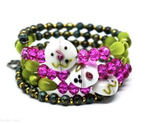 Green and pink beaded bracelet with fun face!